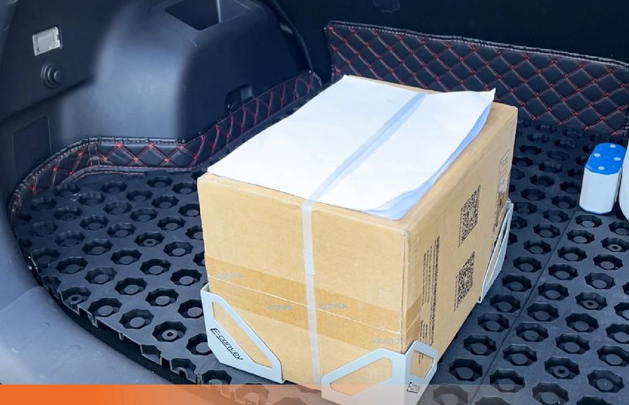 Modular cabin system holding a carton securely in a car boot